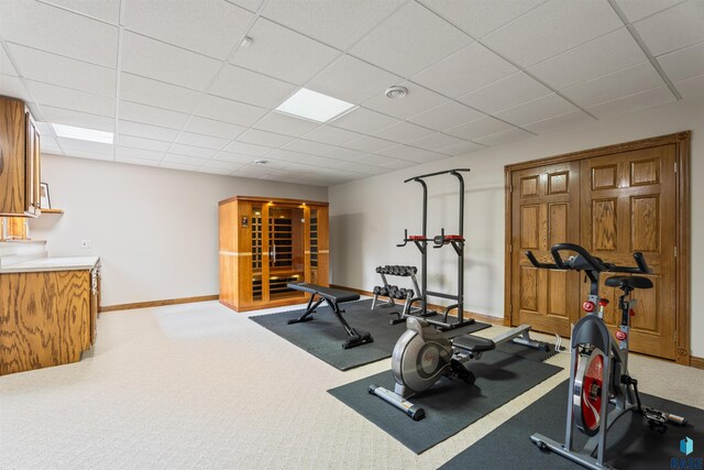 1705 N Deer Hollow Cir, Sioux Falls, SD 57110 - workout room featuring carpet flooring, baseboards, and a paneled ceiling