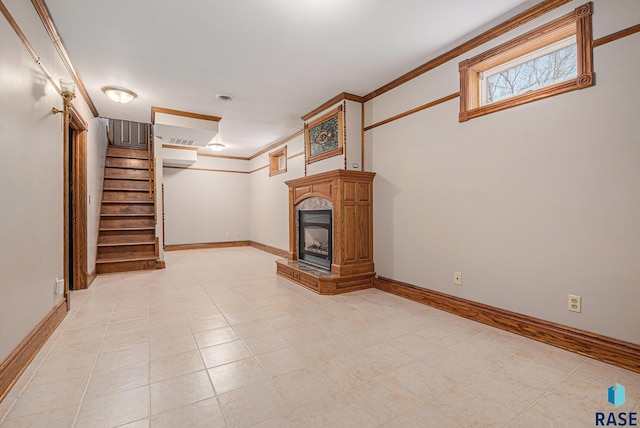 unfurnished living room featuring visible vents, crown molding, a high end fireplace, stairway, and baseboards