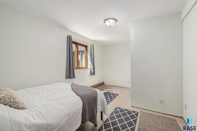 bedroom featuring light colored carpet