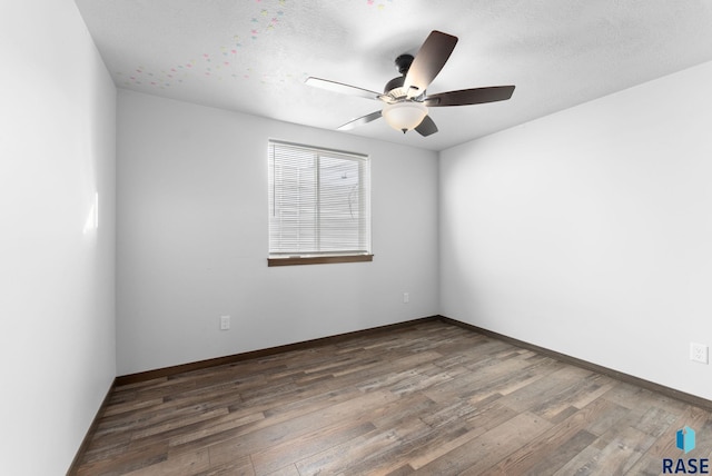 5400 S Whisper Cove Trl, Sioux Falls, SD 57108 - spare room with a ceiling fan, baseboards, and wood finished floors