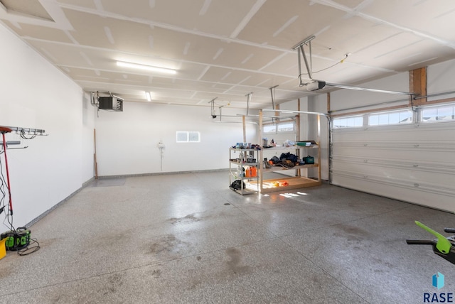 5400 S Whisper Cove Trl, Sioux Falls, SD 57108 - garage with baseboards and a garage door opener