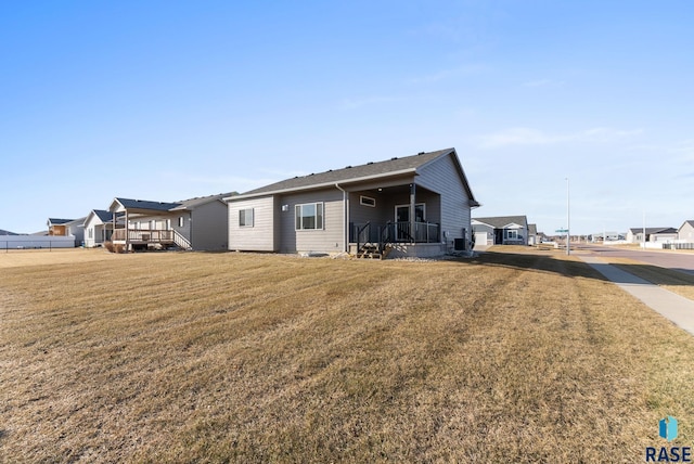 5400 S Whisper Cove Trl, Sioux Falls, SD 57108 - back of house featuring a lawn and a deck