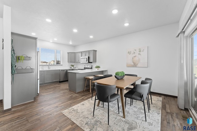 5400 S Whisper Cove Trl, Sioux Falls, SD 57108 - dining space featuring recessed lighting, baseboards, and wood finished floors