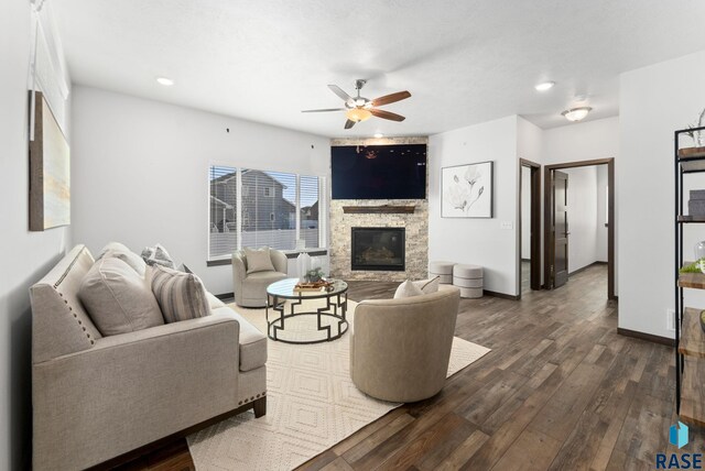 5400 S Whisper Cove Trl, Sioux Falls, SD 57108 - living room with a ceiling fan, recessed lighting, a stone fireplace, and dark wood-type flooring