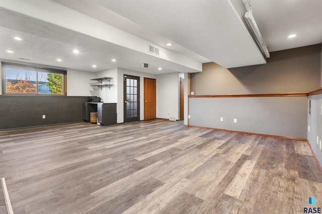 interior space with visible vents, recessed lighting, baseboards, and wood finished floors