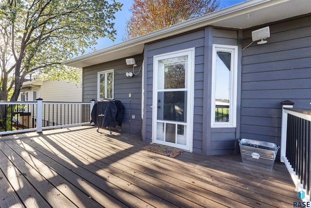 wooden deck featuring area for grilling
