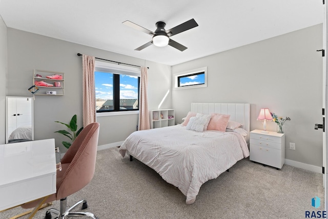 bedroom with baseboards, light carpet, and a ceiling fan