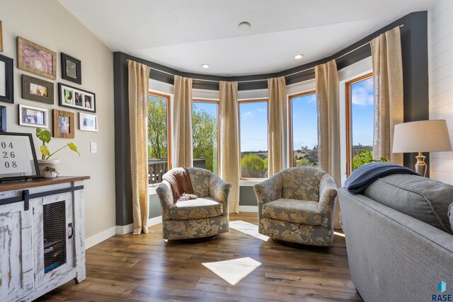 living area featuring wood-type flooring, recessed lighting, and baseboards