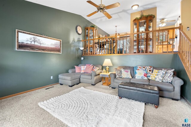 carpeted living room featuring ceiling fan, vaulted ceiling, baseboards, and visible vents