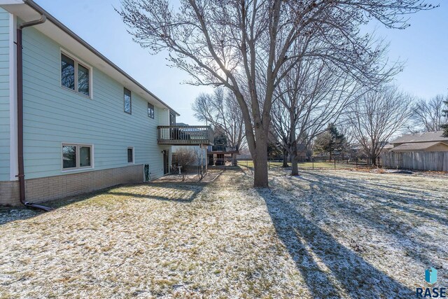view of yard with fence and a wooden deck