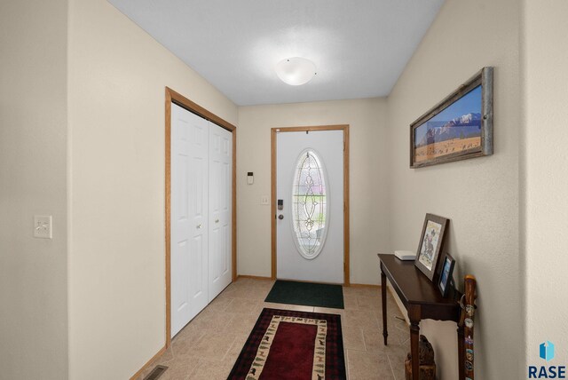 1012 E Magnolia Dr, Brandon, SD 57005 - entryway with light tile patterned flooring and visible vents