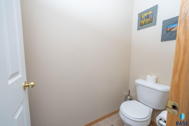 1012 E Magnolia Dr, Brandon, SD 57005 - bathroom with tile patterned flooring, baseboards, and toilet