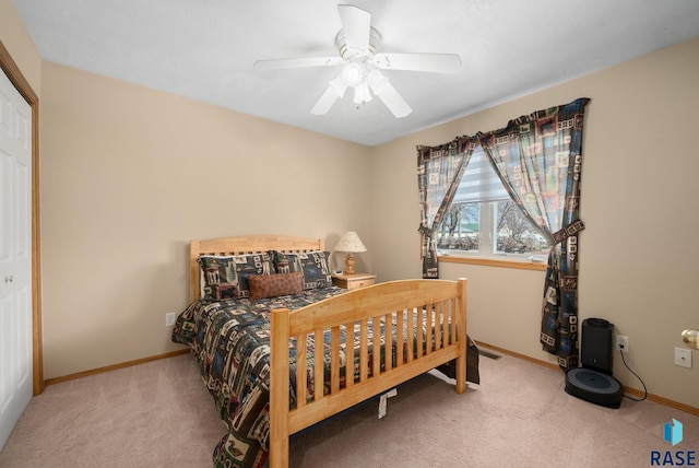 1012 E Magnolia Dr, Brandon, SD 57005 - carpeted bedroom with baseboards and a ceiling fan