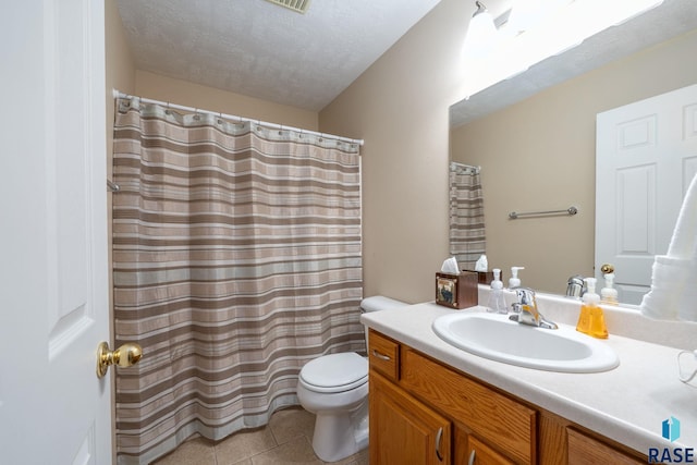 bathroom featuring vanity, toilet, tile patterned floors, a textured ceiling, and curtained shower
