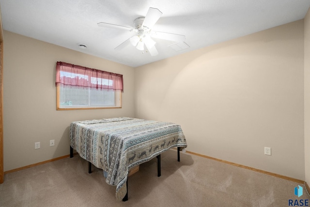 bedroom with carpet floors, a ceiling fan, baseboards, and visible vents
