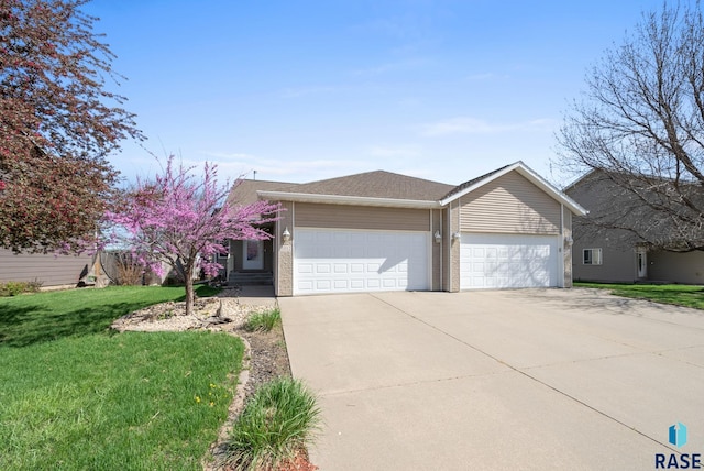 single story home featuring a garage, driveway, and a front yard