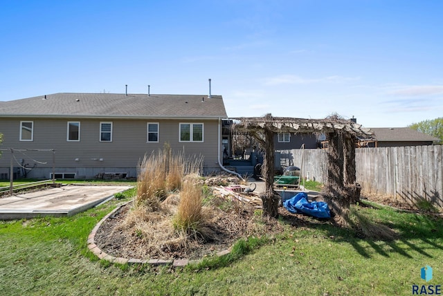 1012 E Magnolia Dr, Brandon, SD 57005 - rear view of property with a lawn and fence