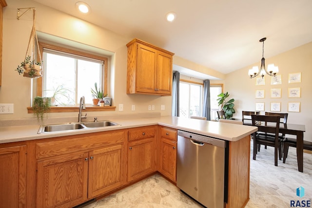 3219 S Grace Ave, Sioux Falls, SD 57103 - kitchen featuring decorative light fixtures, stainless steel dishwasher, a sink, light countertops, and a peninsula