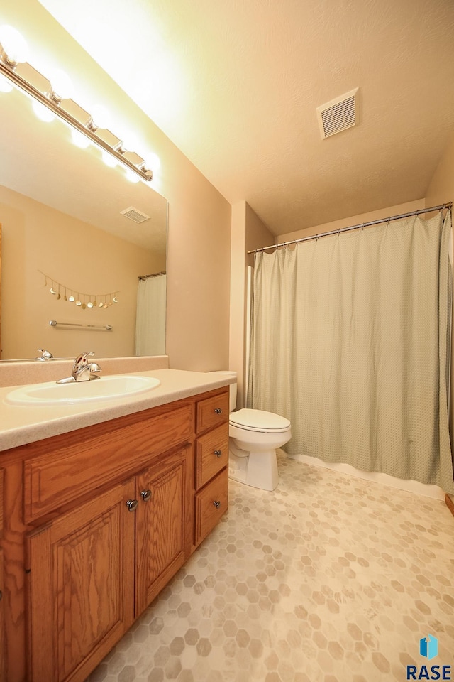 3219 S Grace Ave, Sioux Falls, SD 57103 - full bath with vanity, toilet, and visible vents