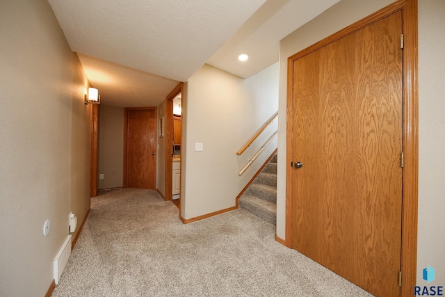 3219 S Grace Ave, Sioux Falls, SD 57103 - hallway featuring carpet floors, baseboards, visible vents, and stairway