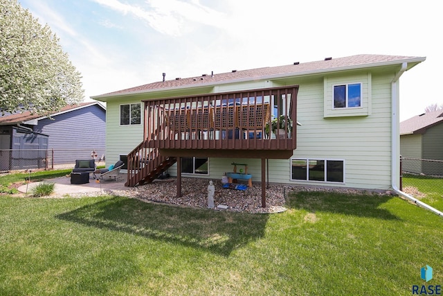 3219 S Grace Ave, Sioux Falls, SD 57103 - rear view of property featuring a lawn, a wooden deck, a patio area, stairway, and fence