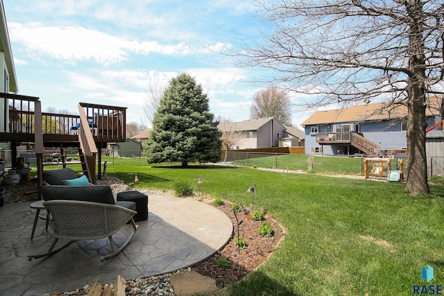 3219 S Grace Ave, Sioux Falls, SD 57103 - view of yard with stairs, fence, a deck, and a patio