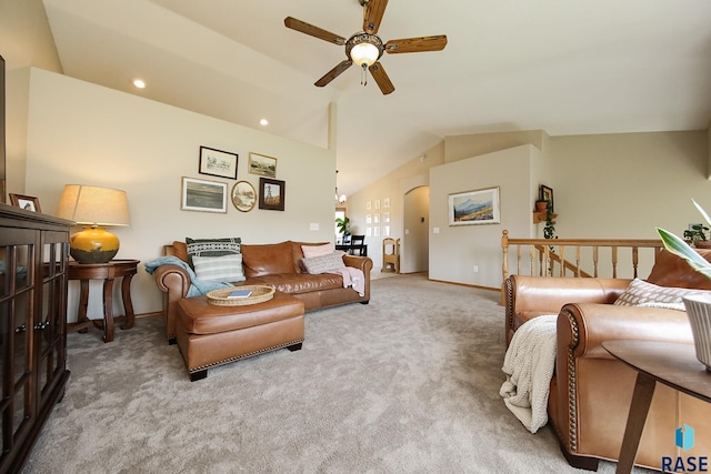 3219 S Grace Ave, Sioux Falls, SD 57103 - living room with lofted ceiling, carpet flooring, baseboards, arched walkways, and a ceiling fan