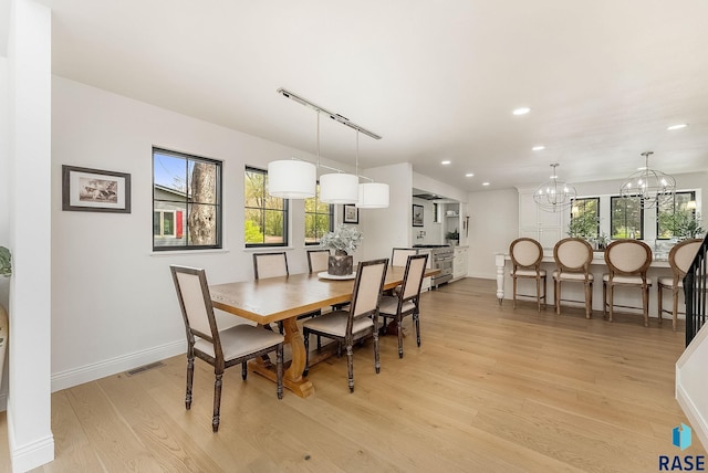 dining space featuring visible vents, recessed lighting, an inviting chandelier, and light wood-type flooring