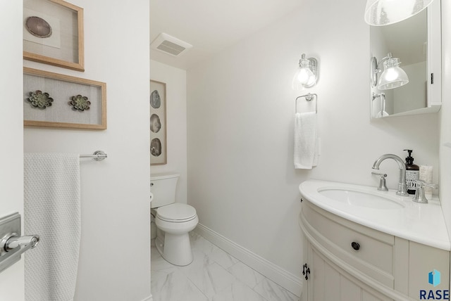 bathroom with visible vents, vanity, baseboards, toilet, and marble finish floor