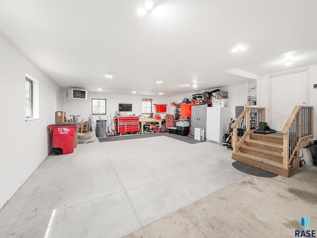 garage featuring a workshop area and recessed lighting