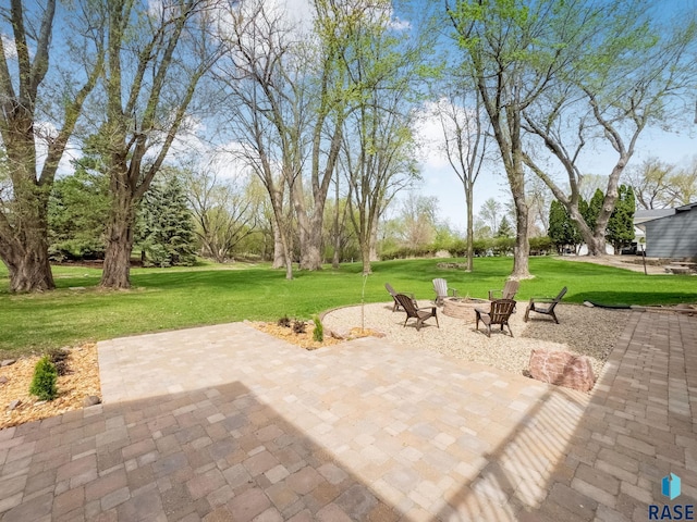 view of patio with a fire pit