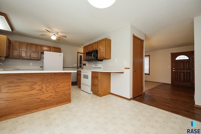 kitchen with brown cabinetry, white appliances, baseboards, ceiling fan, and light countertops