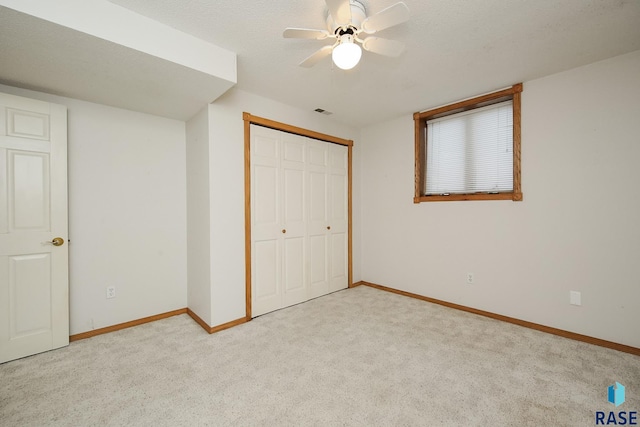 unfurnished bedroom featuring baseboards and carpet