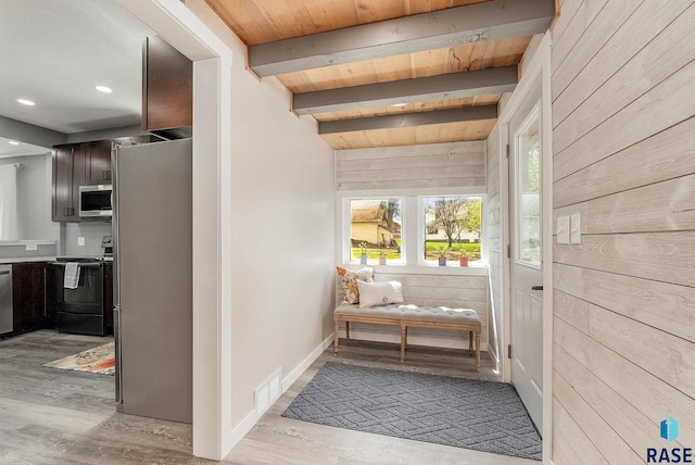 333 S Juniper Ave, Parker, SD 57053 - hallway featuring wooden walls, wood ceiling, visible vents, and wood finished floors