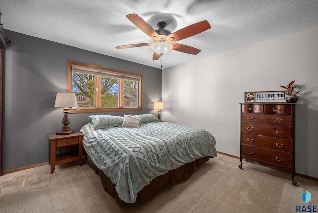4108 E 23rd St, Sioux Falls, SD 57103 - bedroom featuring baseboards, ceiling fan, light carpet, and a textured ceiling