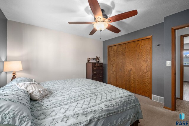 4108 E 23rd St, Sioux Falls, SD 57103 - carpeted bedroom featuring baseboards, a ceiling fan, and a closet