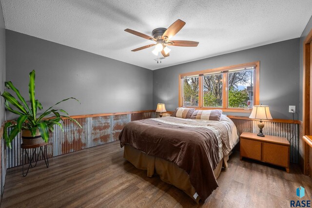 4108 E 23rd St, Sioux Falls, SD 57103 - bedroom with a ceiling fan, a textured ceiling, and wood finished floors