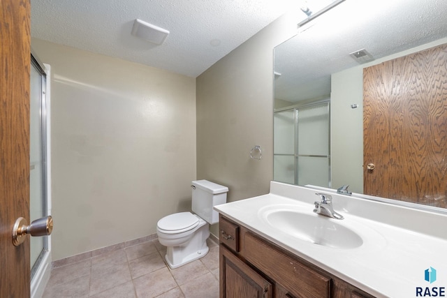 4108 E 23rd St, Sioux Falls, SD 57103 - full bathroom featuring an enclosed shower, toilet, a textured ceiling, and vanity