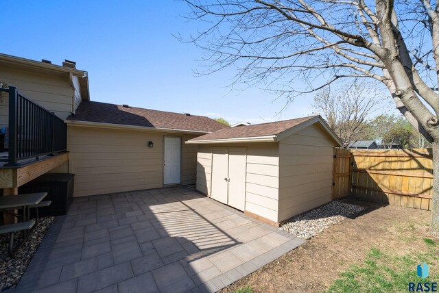 4108 E 23rd St, Sioux Falls, SD 57103 - view of patio with a storage shed, fence, and an outdoor structure