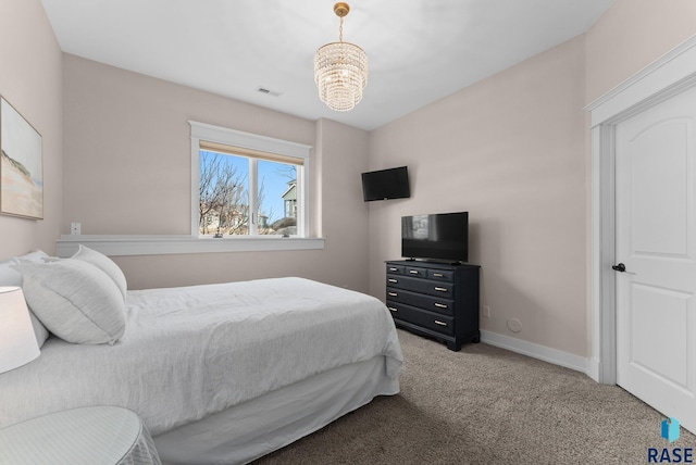 bedroom featuring visible vents, carpet, baseboards, and a chandelier