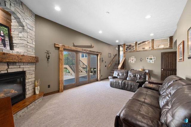 living area with a stone fireplace, recessed lighting, carpet, and baseboards