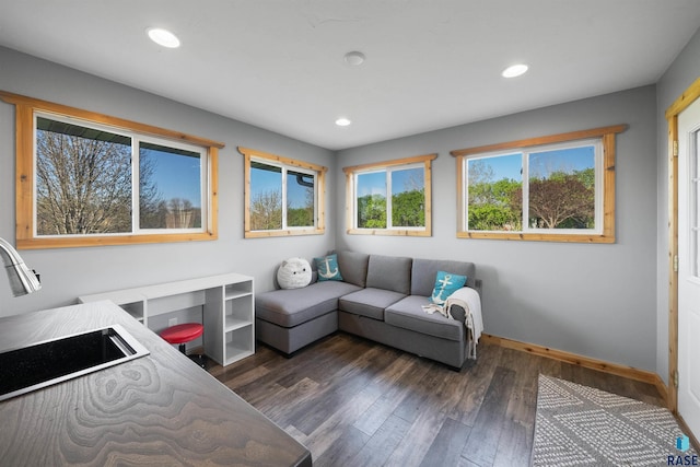 living room featuring recessed lighting, baseboards, and dark wood finished floors