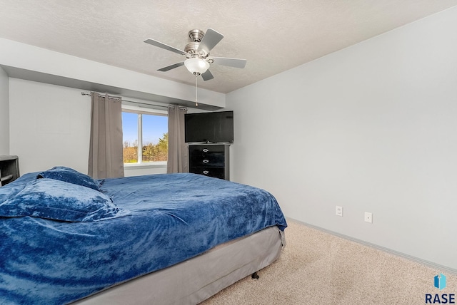 bedroom with baseboards, ceiling fan, and carpet flooring