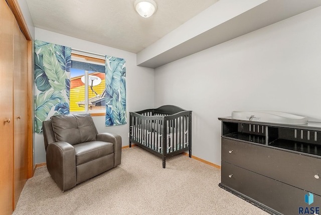 bedroom with carpet floors and baseboards