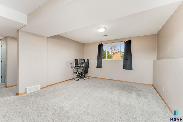 interior space featuring carpet floors, baseboards, and visible vents