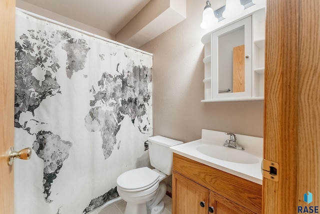 full bathroom featuring toilet, a shower with shower curtain, tile patterned flooring, and vanity