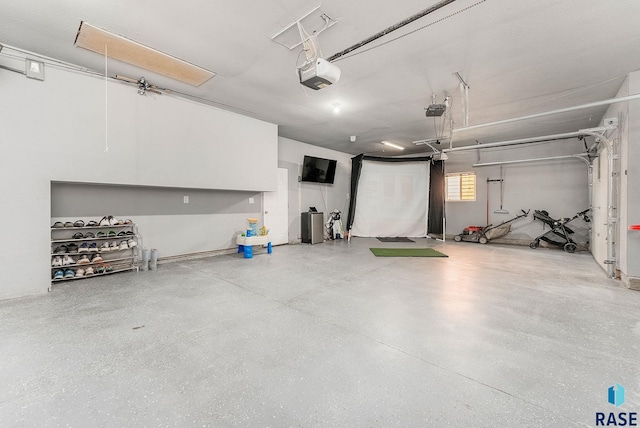 garage featuring a garage door opener