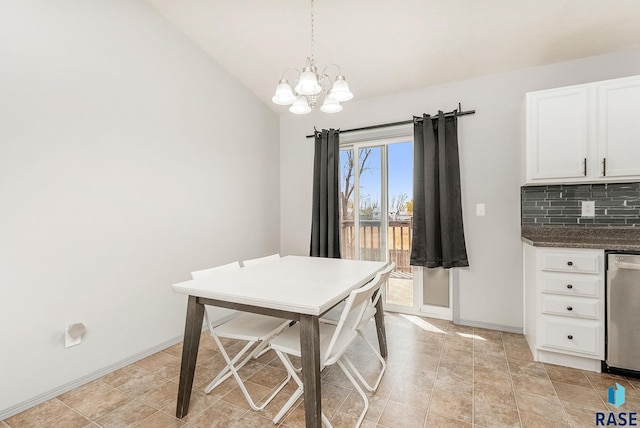 dining room with baseboards, a chandelier, and lofted ceiling