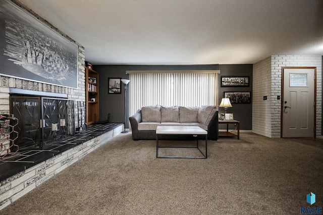 living room featuring carpet flooring, a textured ceiling, and a fireplace