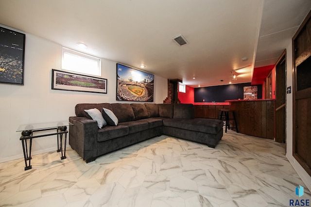 living room featuring visible vents and marble finish floor